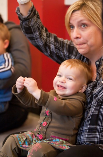 Mom and child sing a song in Music Together class.