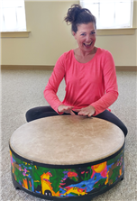 Music Together teacher Wendy Melkonian drumming with joy