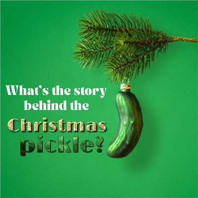 A pickle hanging of a needle twig, Text: Waht's the story behind the Christmas pickle?